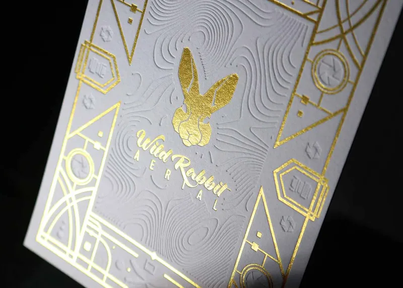 Aerial view of blind deboss letterpress work paired with foil stamping