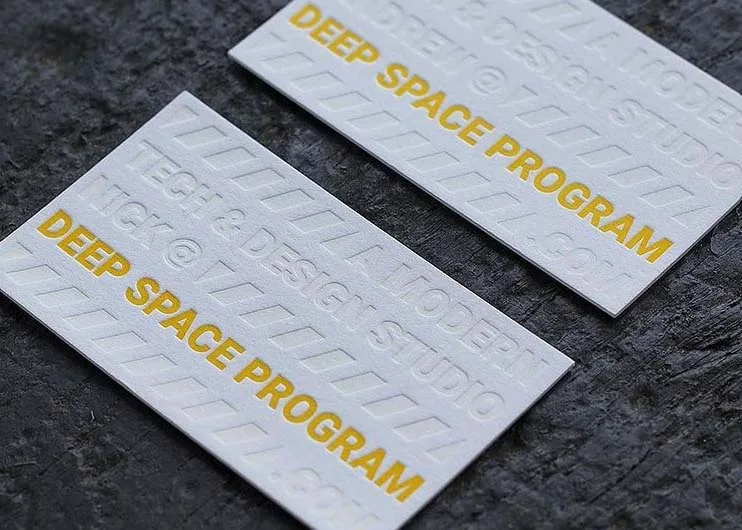 Blind deboss and letterpress business card on white cotton paper