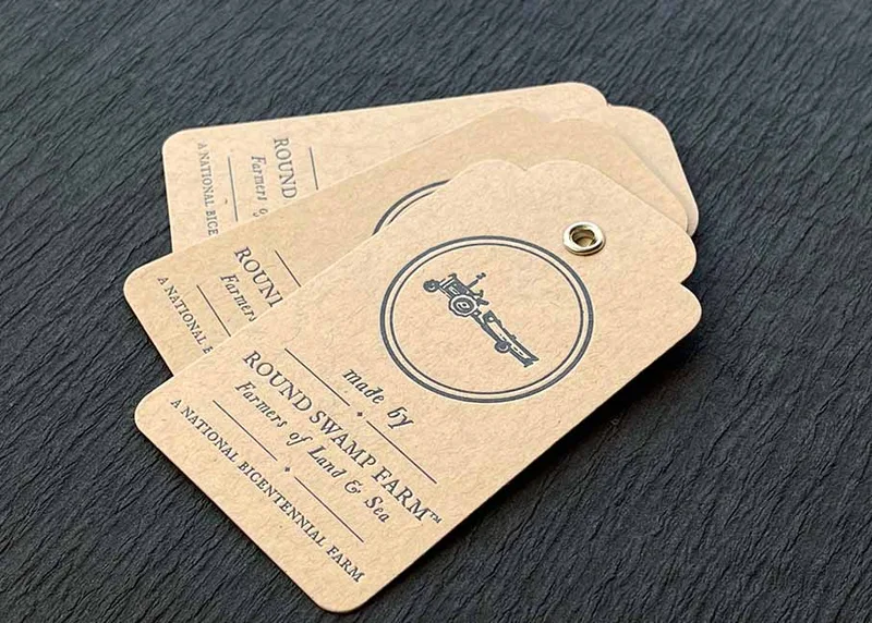 Letterpress hang tags on kraft paper with silver eyelets