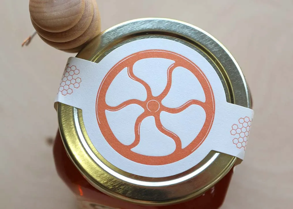 Close-up of two-color letterpress printing on textured Strathmore Label stock