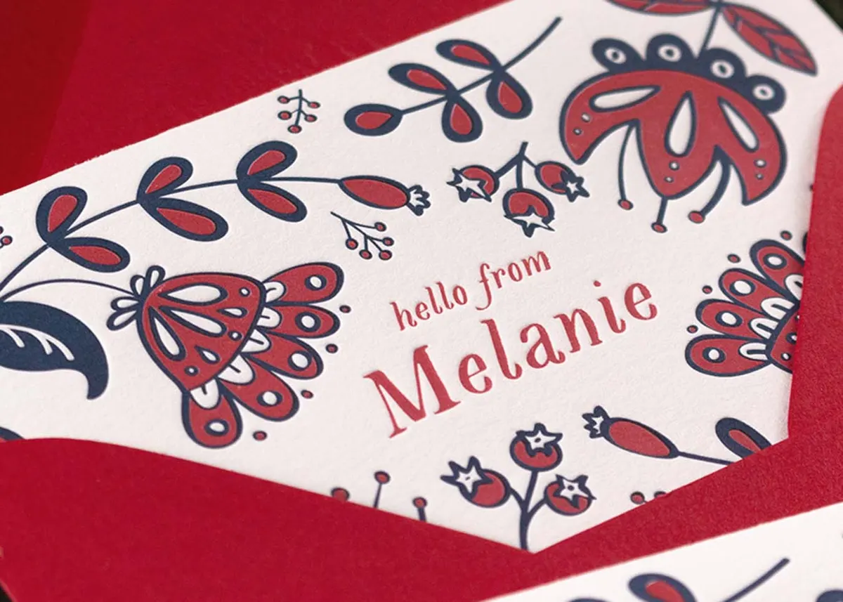Die-cut letterpress note card shown folded with floral design on Crane's Lettra paper