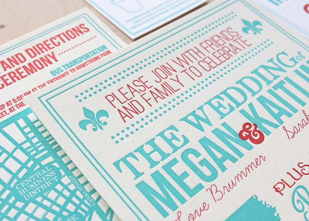 Letterpress RSVP card detail showing two-color blue and red printing on cotton paper